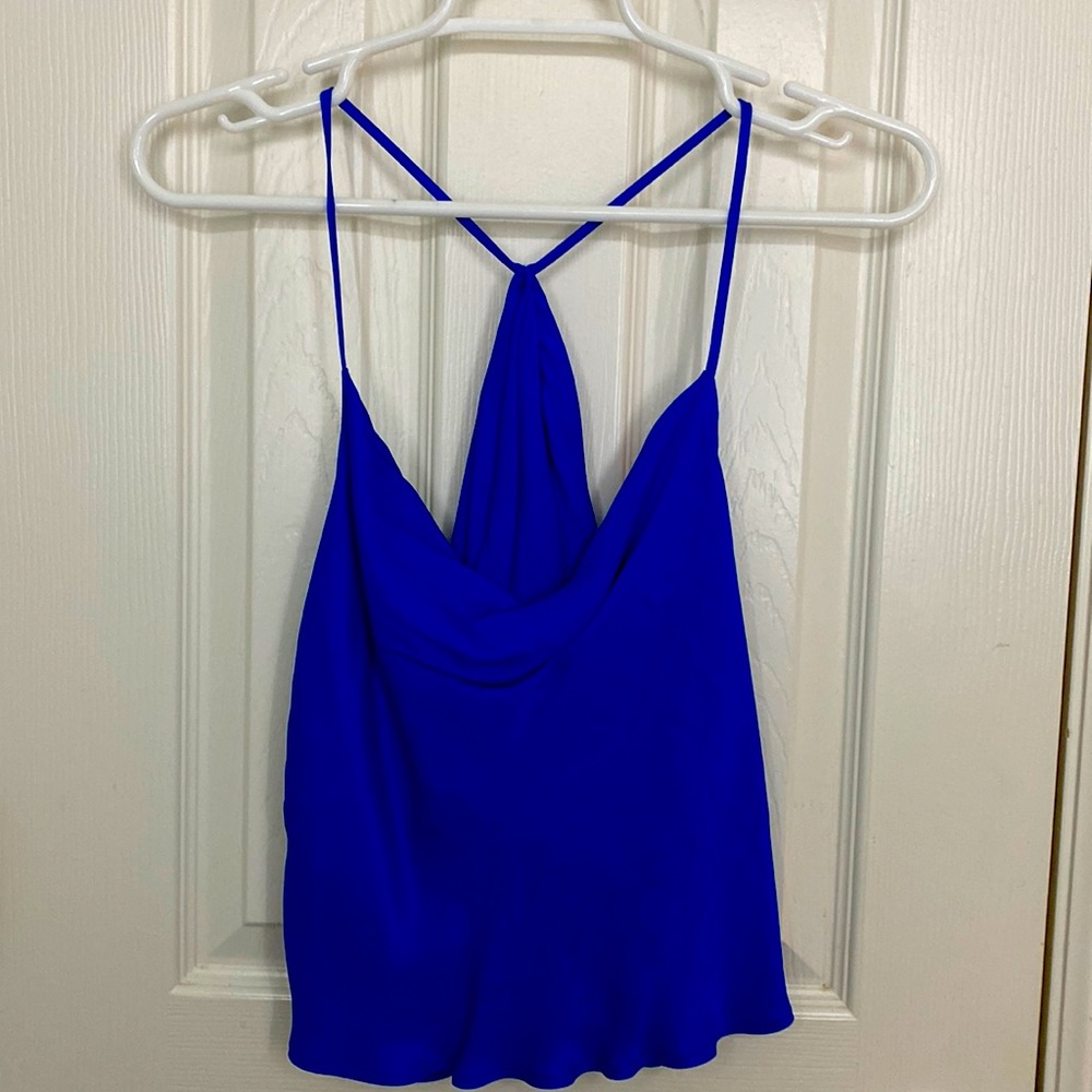 A blue satin top with open back